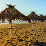 Tropical parasols at Metaponto beach. Basilicata, in Italy